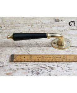 LEVER HANDLE ON ROUND ROSE EBONY AND BRASS 120MM