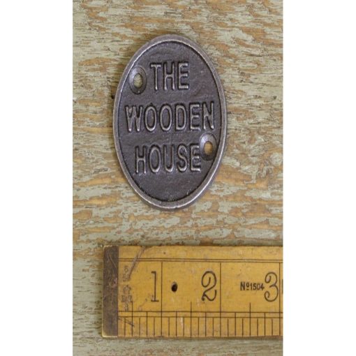 PLAQUE CIRCULAR THE WOODEN HOUSE CAST ANTIQUE IRON 50MM