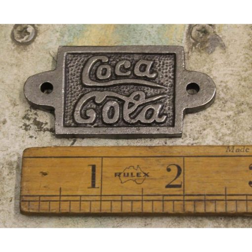 PLAQUE COKE FITS CAP CATCHER CAST ANTIQUE IRON