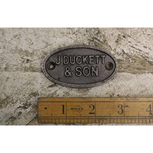 PLAQUE OVAL J DUCKET & SON ANT IRON 75MM TBD